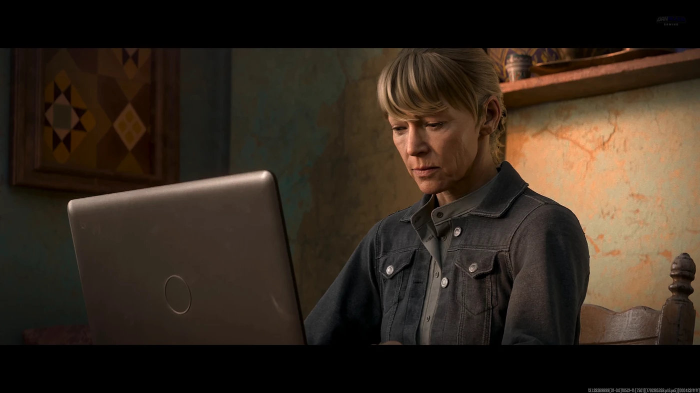 Laswell at her laptop in a sunlit room in the MW4 after-credits scene